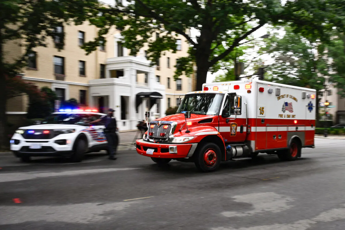 An ambulance passes a police barricade near the National Zoo in Washington on Aug. 29, 2023. (Andrew Caballero-Reynolds/AFP via Getty Images)