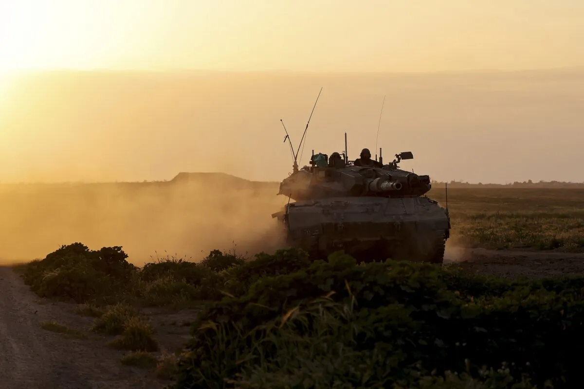 An Israeli army tank moving along the border area from Israel near the border with the Gaza Strip on March 6, 2024. (Jack Guez/AFP via Getty Images)
