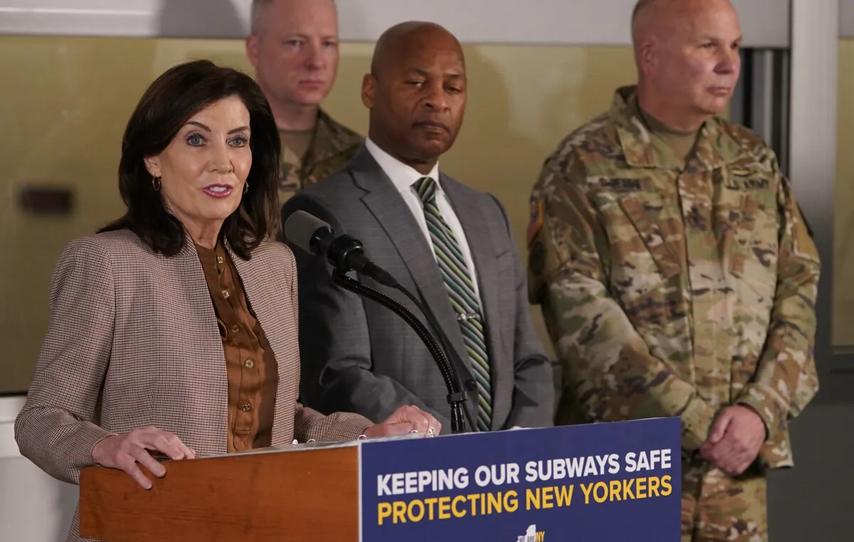 New York Gov. Kathy Hochul (L), with State Police Acting Superintendent Steven James (C) and Adjutant General of the New York National Guard Maj. Gen. Ray Shields (R), at the New York City Mass Transit Authority Rail Control Center on March 6, 2024. (Timothy A. Clary/AFP via Getty Images)
