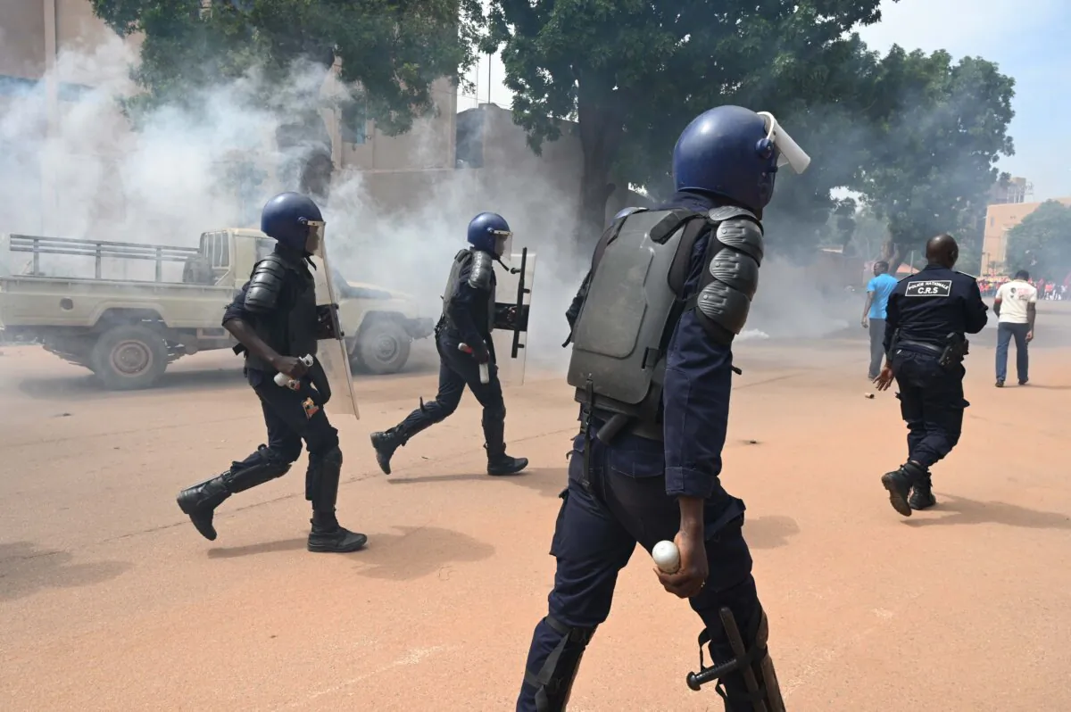 Riot police officers disperse a march called by the UAS union to call for better security measures against terrorism in Ouagadougou, Burkina Faso, on Sept. 16, 2019. (Issouf Sanogo/AFP via Getty Images)