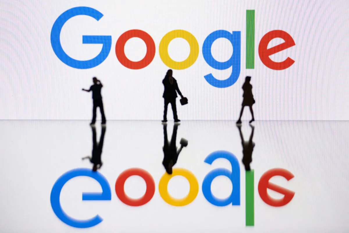 Figurines are displayed next to a screen displaying a logo of Google in Mulhouse, France, on Oct. 30, 2023. (Sebastien Bozon/AFP via Getty Images)
