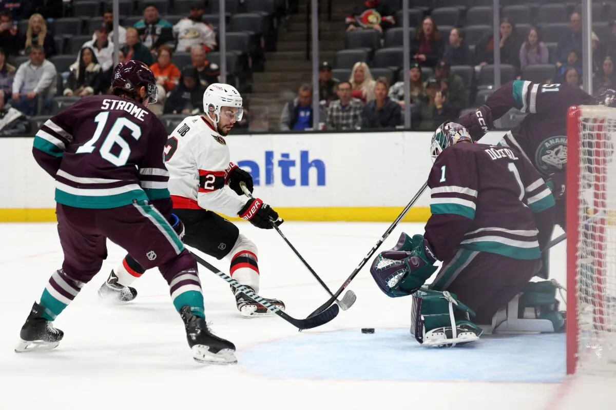 Anaheim Ducks goaltender Lukas Dostal (1) vies for puck against Ottawa Senators defenseman Artem Zub (2) during the first period in Anaheim, Calif., on March 6, 2024. (Kiyoshi Mio/USA TODAY Sports via Field Level Media)