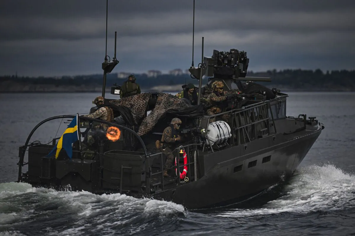 Soldiers from the Swedish Amphibious Corps and the U.S. Marine Corps ride on the CB90-class fast assault craft, as they participate in military exercise Archipelago Endeavor 23 on Mällsten island in the Stockholm Archipelago on Sept. 13, 2023. (Jonathan Nackstrand/AFP via Getty Images)