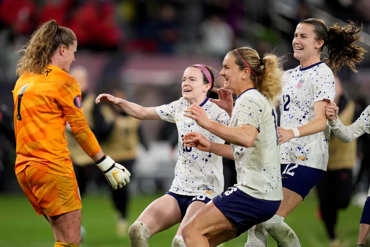 United States goalkeeper Alyssa Naeher (L), celebrates with teammates at the end of the penalty shootout in a CONCACAF Gold Cup women's soccer tournament semifinal match against Canada in San Diego on March 6, 2024. (Gregory Bull/AP Photo)
