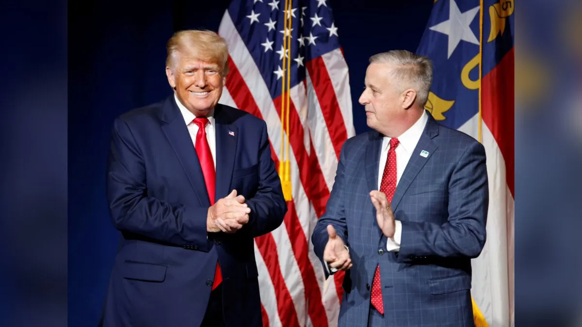 Former President Donald Trump (L) is introduced by then North Carolina Republican Party chairman Michael Whatley before speaking at the North Carolina GOP convention dinner in Greenville, N.C., on June 5, 2021. (Jonathan Drake/Reuters)