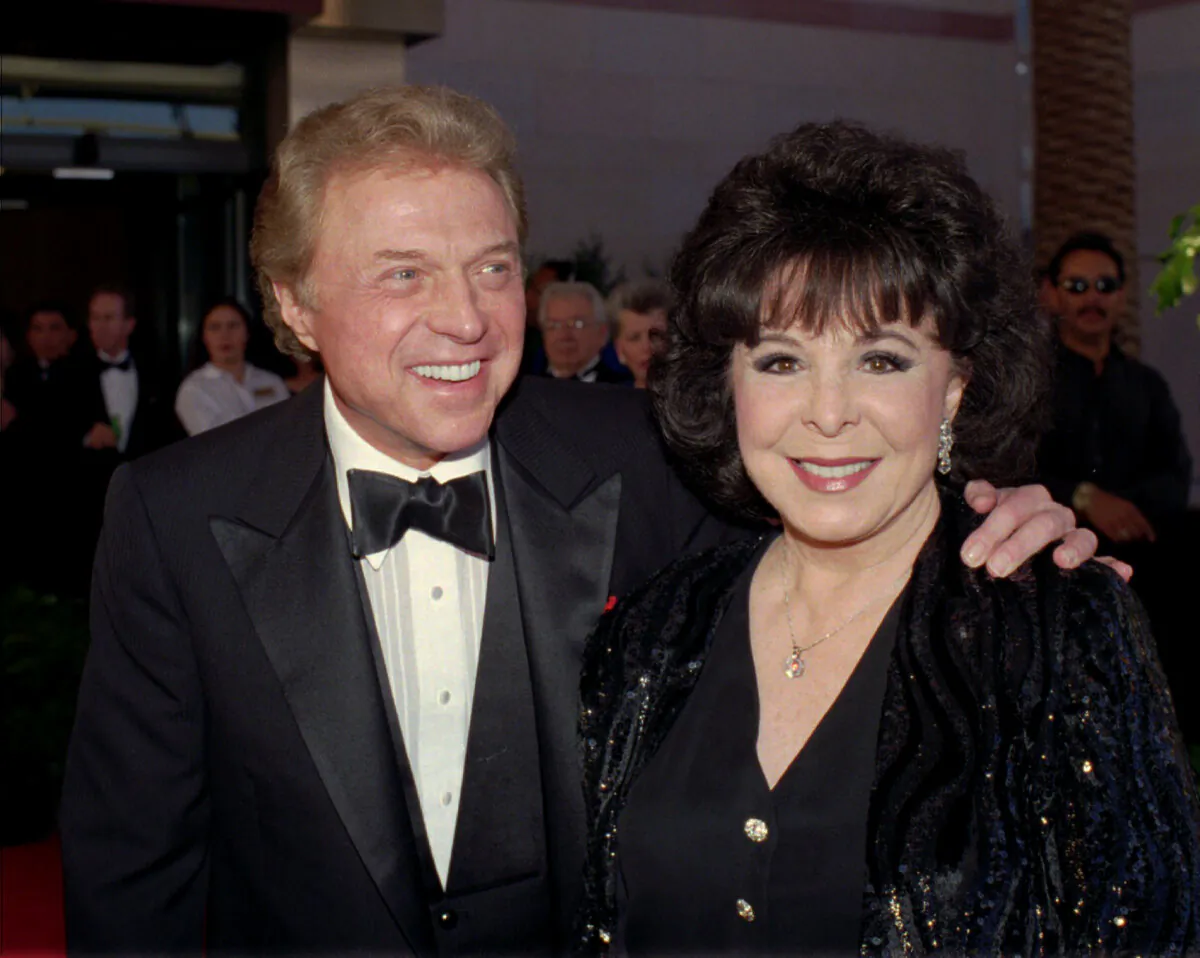 Singer Steve Lawrence (L) and his wife Eydie Gorme arrive at a black-tie gala called honoring Frank Sinatra in Las Vegas on May 30, 1998. (Lennox McLendon/AP Photo)
