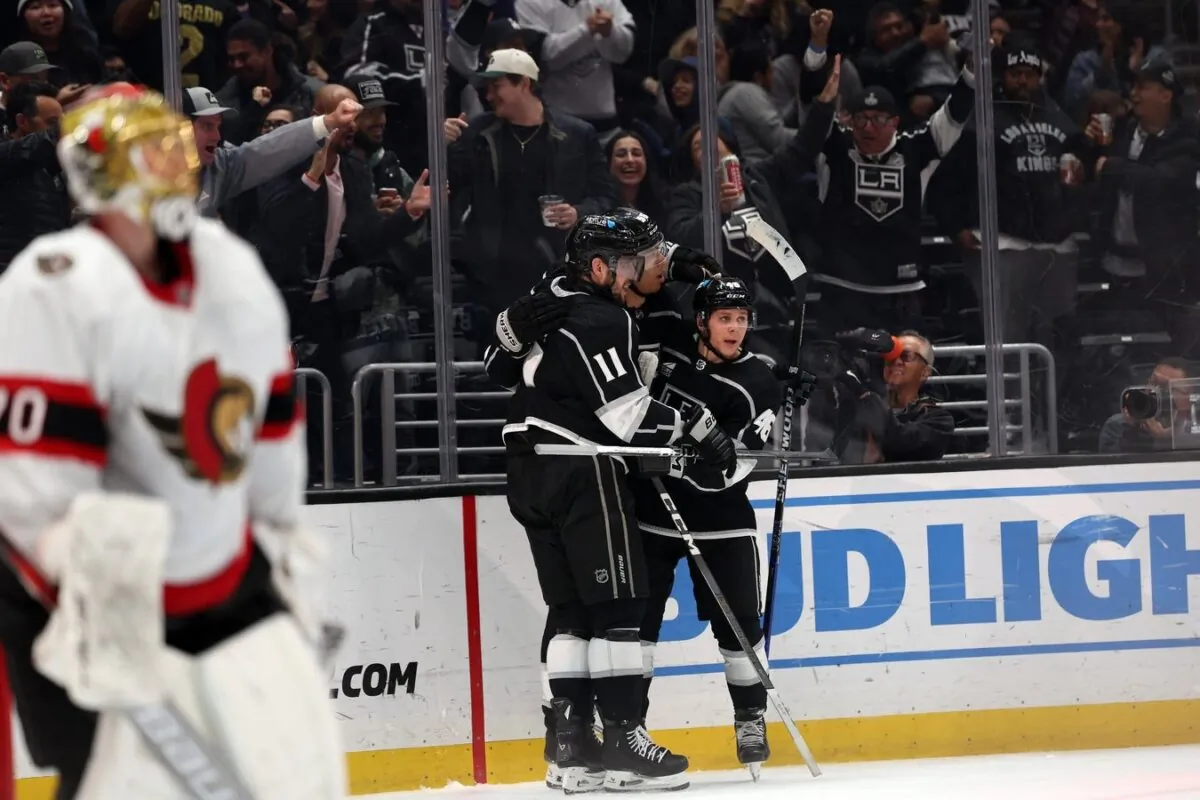 Los Angeles Kings right wing Quinton Byfield (55) celebrates a goal with center Anze Kopitar (11) and center Blake Lizotte (46) during the second period against the Ottawa Senators in Los Angeles on March 7, 2024. (Kiyoshi Mio/USA TODAY Sports via Field Level Media)