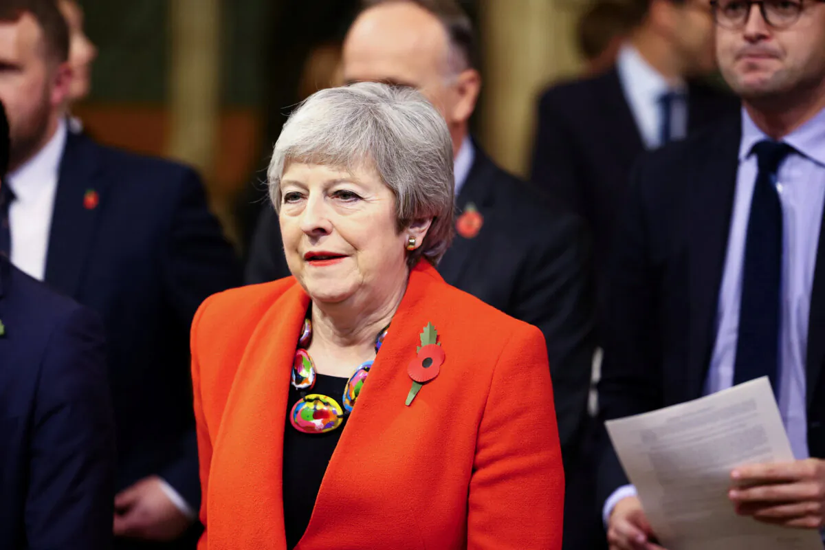 Former Prime Minister Theresa May walks through the Members' Lobby at the Palace of Westminster ahead of the State Opening of Parliament in the House of Lords, London, on Nov. 7, 2023. (Hannah McKay/PA Wire)