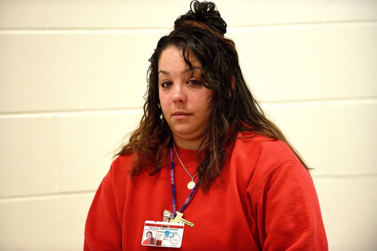 Kayla Montgomery stands and looks over to the gallery after her parole board hearing at the New Hampshire Correctional Facility for Women in Concord, N.H., on March 7, 2024. (David Lane/Pool/Union Leader via AP)