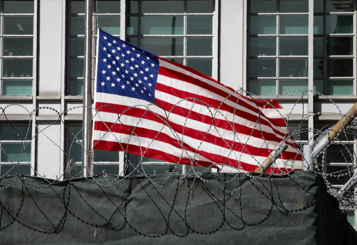 A flag flies behind an enclosure on the territory of the U.S. embassy in Moscow on March 28, 2018. (REUTERS/Tatyana Makeyeva/File Photo)