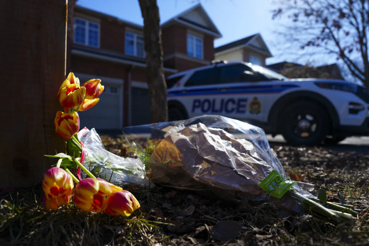 Flowers sit at the scene of a homicide where six people were found dead in the Barrhaven suburb of Ottawa on Mar. 7, 2024. (The Canadian Press/Sean Kilpatrick)