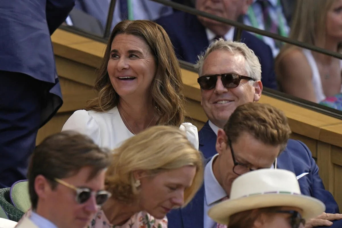 Melinda French Gates (C) sits in the Royal Box on Centre Court to watch Serbia's Novak Djokovic and Britain's Cameron Norrie in a men's singles semifinal on day twelve of the Wimbledon tennis championships in London on July 8, 2022. (Alastair Grant/AP Photo)