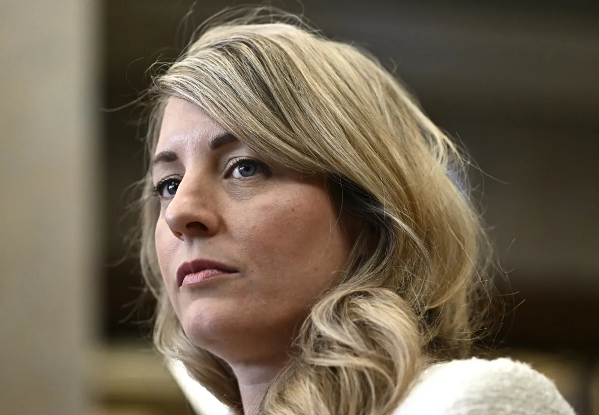 Minister of Foreign Affairs Melanie Joly listens to questions from reporters in the Foyer of the House of Commons on Parliament Hill after Question Period, in Ottawa on Feb. 29, 2024. (The Canadian Press/Justin Tang)