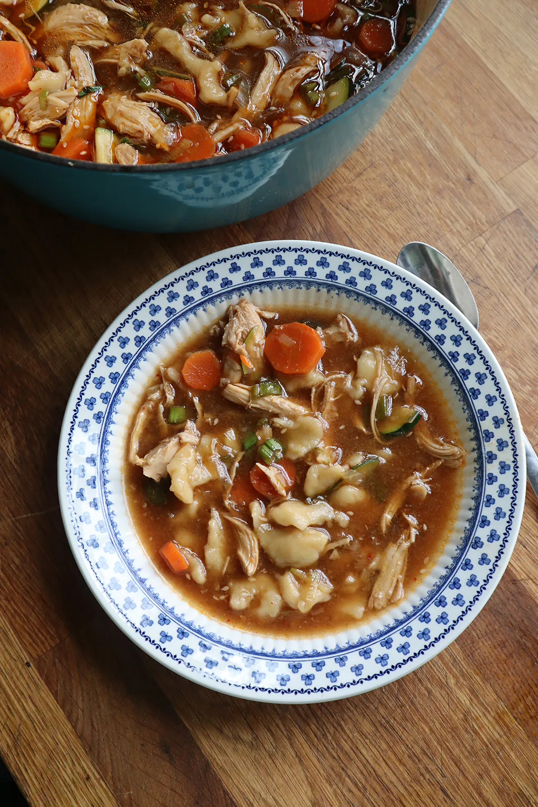 Seasoned with gochugaru, gochujang and soy sauce, this spicy chicken soup with hand-pulled noodles is packed with umami. (Gretchen McKay/Pittsburgh Post-Gazette/TNS)