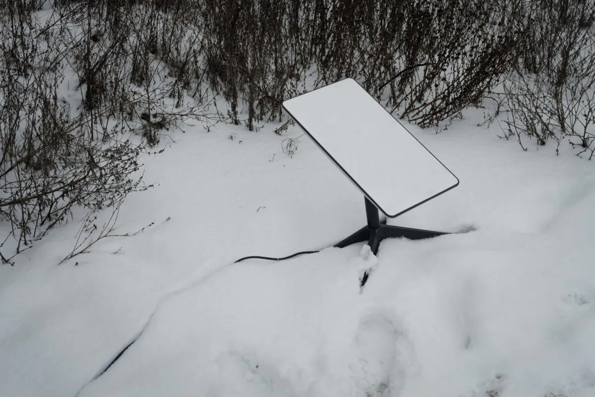 The antenna of the Starlink satellite-based broadband system is seen in the snow in Bakhmut, Ukraine, on Feb. 16, 2023. (Yasuyoshi Chiba/AFP via Getty Images)