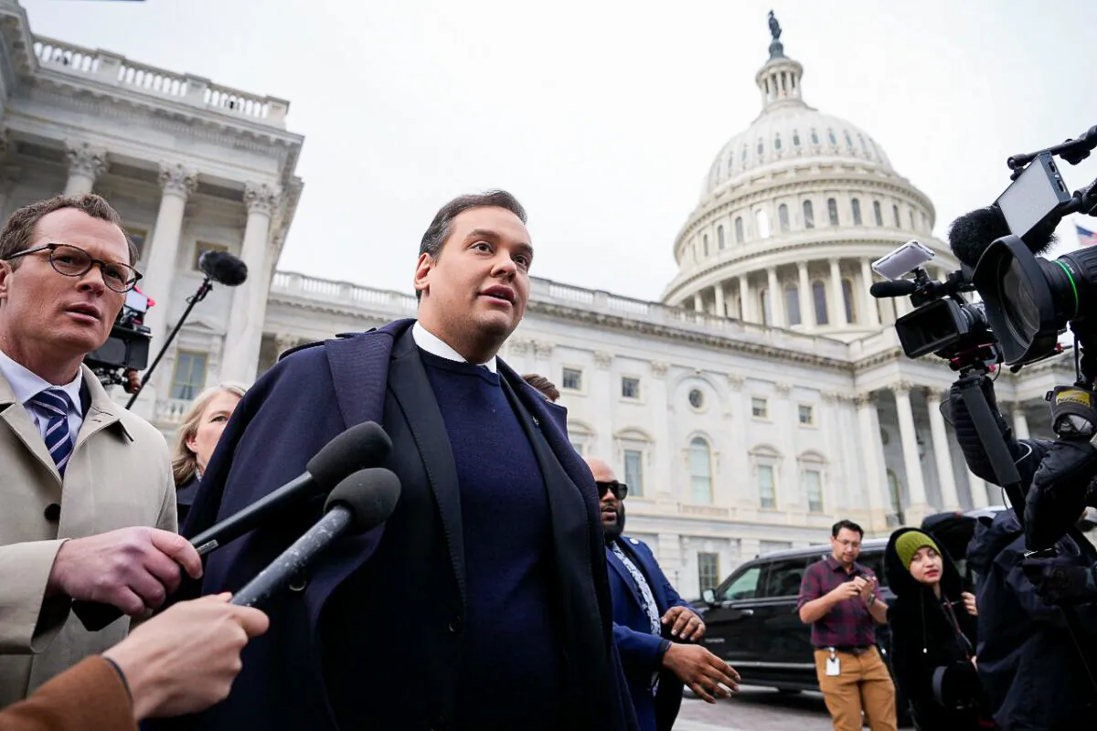 Rep. George Santos (R-N.Y.) is surrounded by journalists as he leaves the U.S. Capitol after his fellow members of Congress voted to expel him from the House of Representatives on Dec. 1, 2023 in Washington. (Drew Angerer/Getty Images)