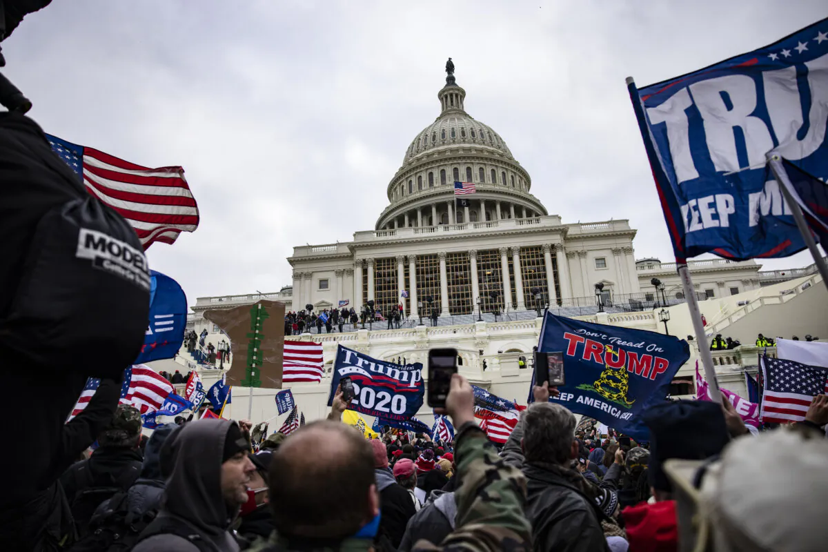 Pro-Trump supporters storm the U.S. Capitol following a rally with President Donald Trump in Washington, on Jan. 6, 2021. (Samuel Corum/Getty Images)