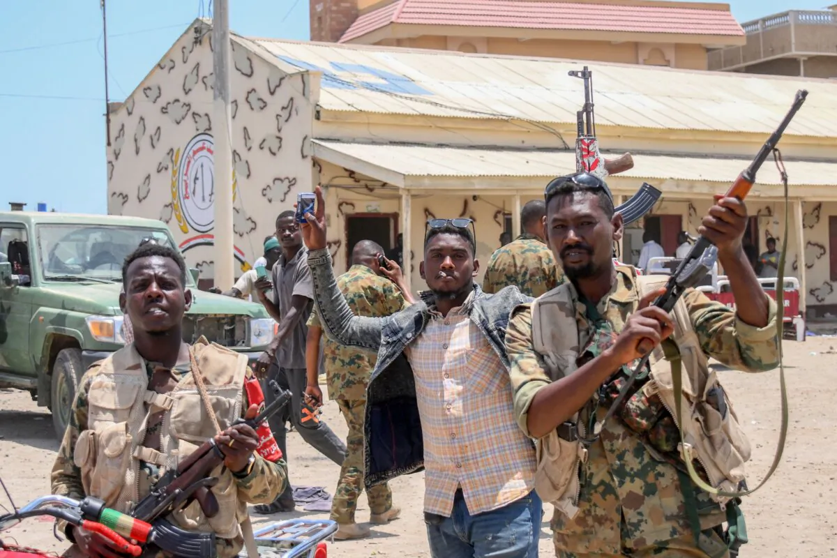 Sudanese army soldiers, loyal to army chief Abdel Fattah al-Burhan, posing for a picture at the Rapid Support Forces (RSF) base in the Red Sea city of Port Sudan on April 16, 2023. (AFP via Getty Images)