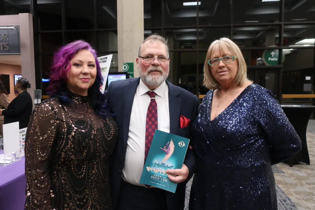 Julia Lindsay (R) and guests enjoyed Shen Yun Performing Arts at Center for Performing Arts at Governors State University, University Park, Ill., the evening of March 9, 2024. (Stacey Tang/The Epoch Times)