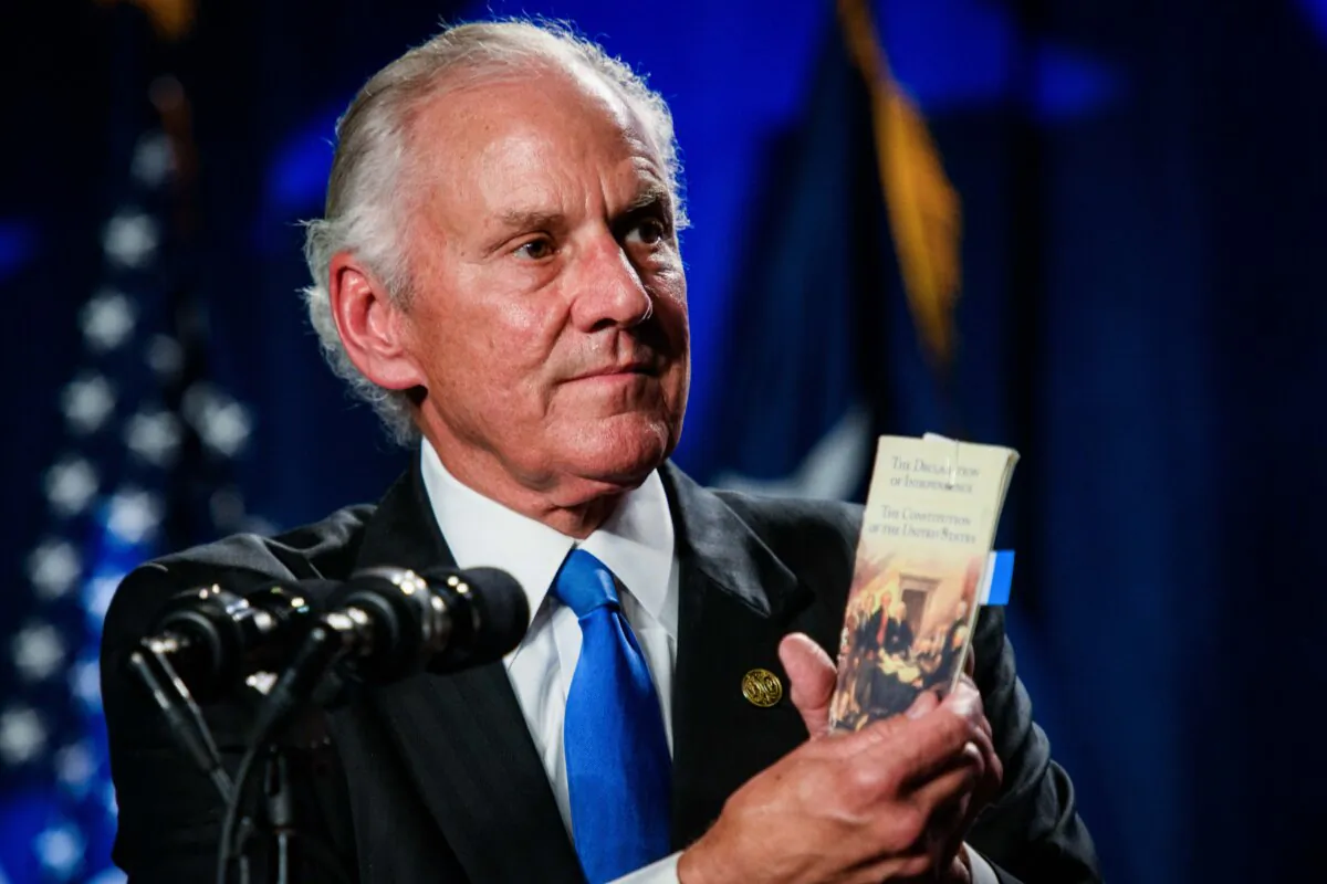 South Carolina Gov. Henry McMaster holds up a copy of the U.S. Constitution while speaking in Columbia, S.C., on Aug. 5, 2023. (Melissa Sue Gerrits/Getty Images)