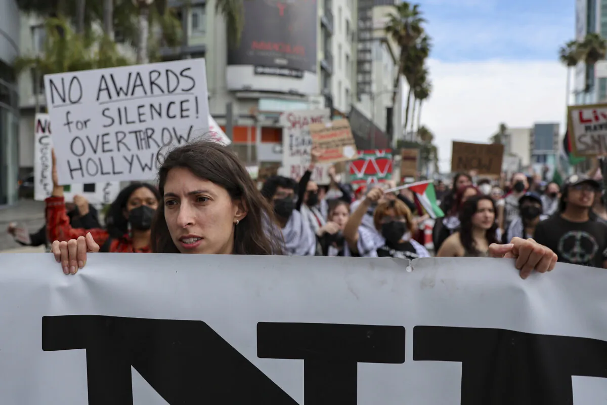 Protesters gather during a demonstration in support of Palestinians calling for a ceasefire in Gaza as the 96th Academy Awards Oscars ceremony is held nearby, in the Hollywood section of Los Angeles, on March 10, 2024. (Etienne Laurent/AP Photo)