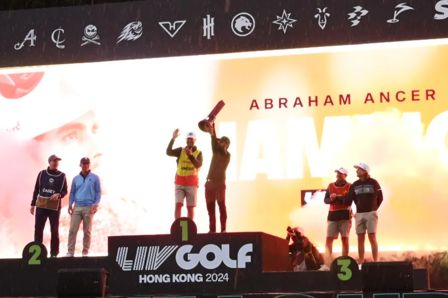 The individual winners podium of the LIV Golf tournament in Hong Kong, showing the champion, Abraham Ancer together with second placed Paul Casey and Cameron Smith, at Fanling Golf Club, Hong Kong on March 10, 2024. (Bill Cox/The Epoch Times)