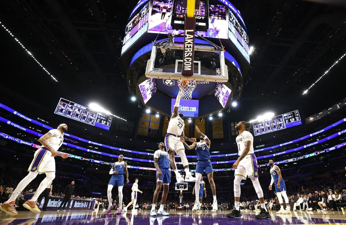 LeBron James (23) of the Los Angeles Lakers makes a slam dunk against the Minnesota Timberwolves in the second half in Los Angeles on March 10, 2024. (Ronald Martinez/Getty Images)