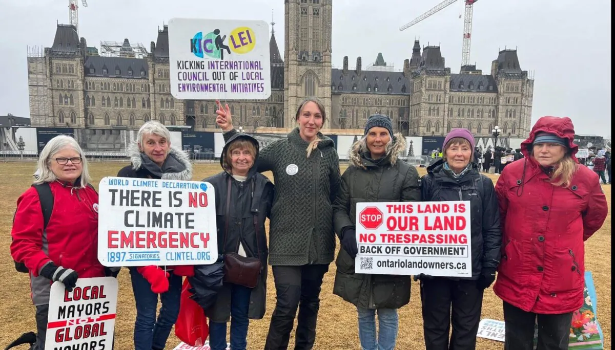Maggie Braun (C) with other Stand United supporters protesting in front of the Parliament Buildings in Ottawa on March 9, 2024. (Courtesy Yan Parisien)