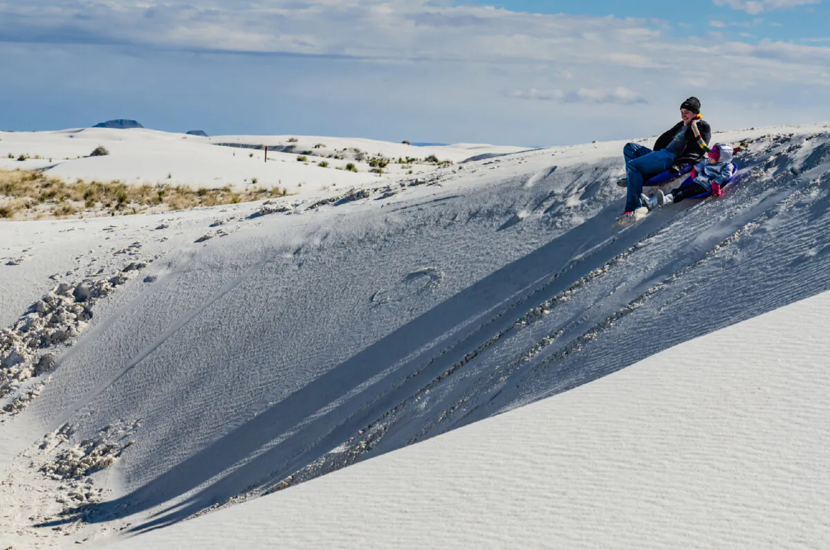 Dune-sledding is a popular pastime at White Sands National Monument in New Mexico. (Sandra Foyt/Dreamstime)