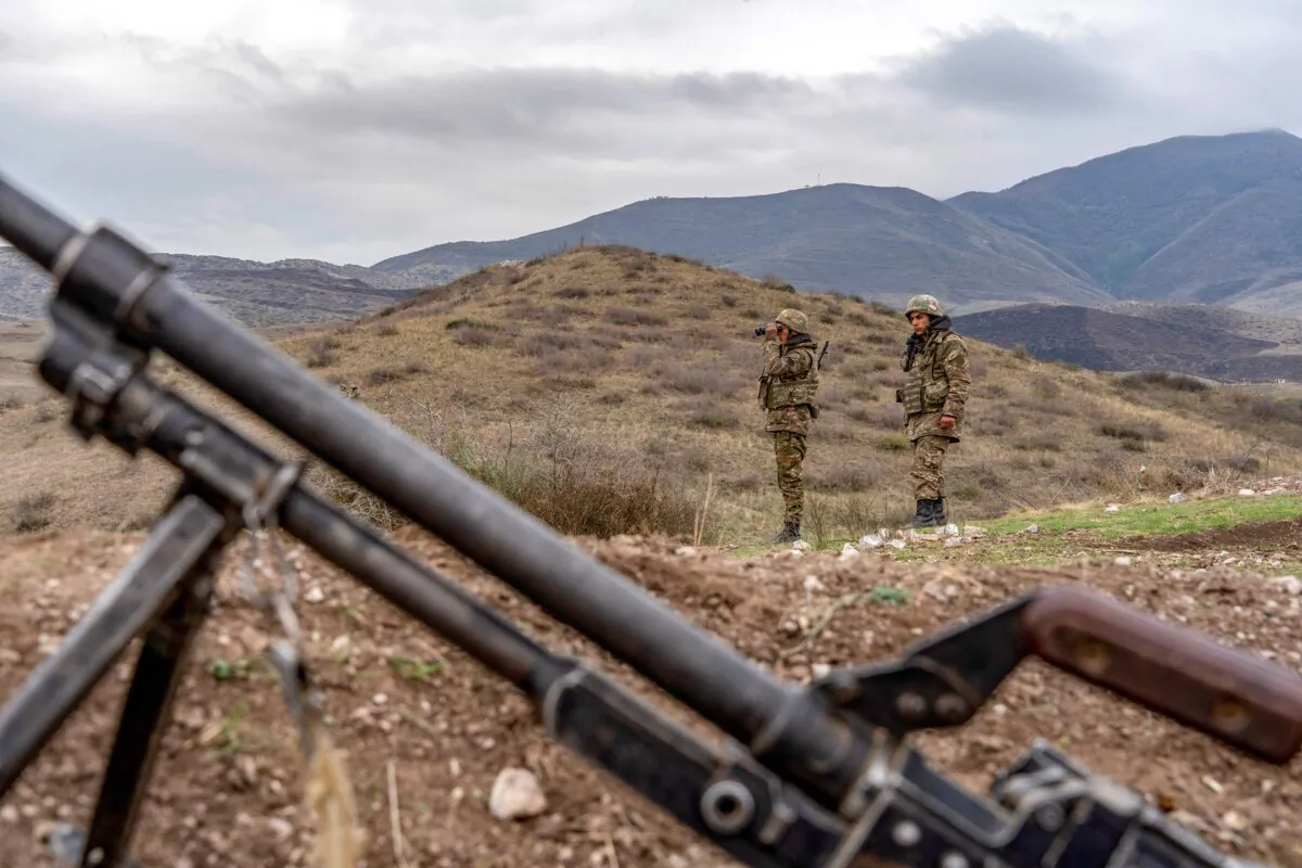 Armenian soldiers patrol at the checkpoint near a demarcation line outside Askeran, in the disputed region of Nagorno-Karabakh, after Armenia and Azerbaijan agreed to a Russia-brokered cease-fire on Nov. 9, 2020, ending six weeks of fighting in the self-proclaimed republic, on Nov. 21, 2020. (Andrey Borodulin/AFP via Getty Images)