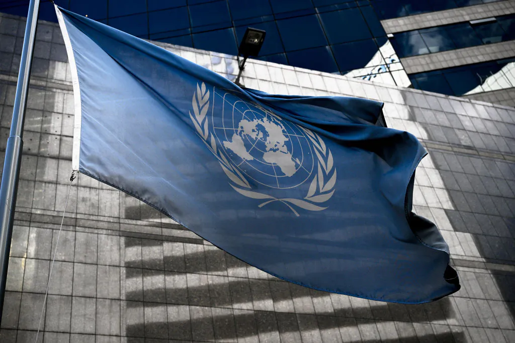 The United Nations flag waves outside the Technical Advisory Office of the United Nations High Commissioner for Human Rights headquarters in Caracas, on February 15, 2024. (Photo by Federico PARRA / AFP) (Photo by FEDERICO PARRA/AFP via Getty Images)