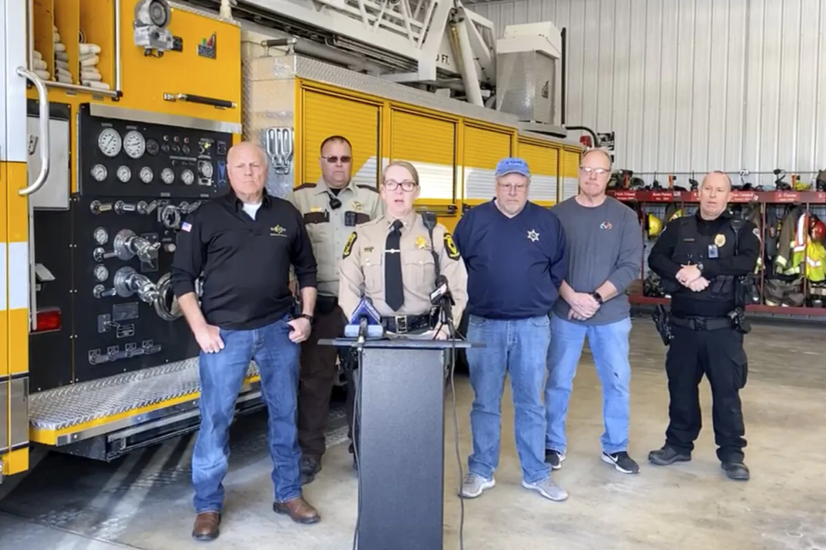 In this image made from video, Illinois State Police Capt. Jody Huffman, at podium, speaks during a news conference about the school bus collision on March 11, 2024. (Illinois State Police Troop 6 via AP)