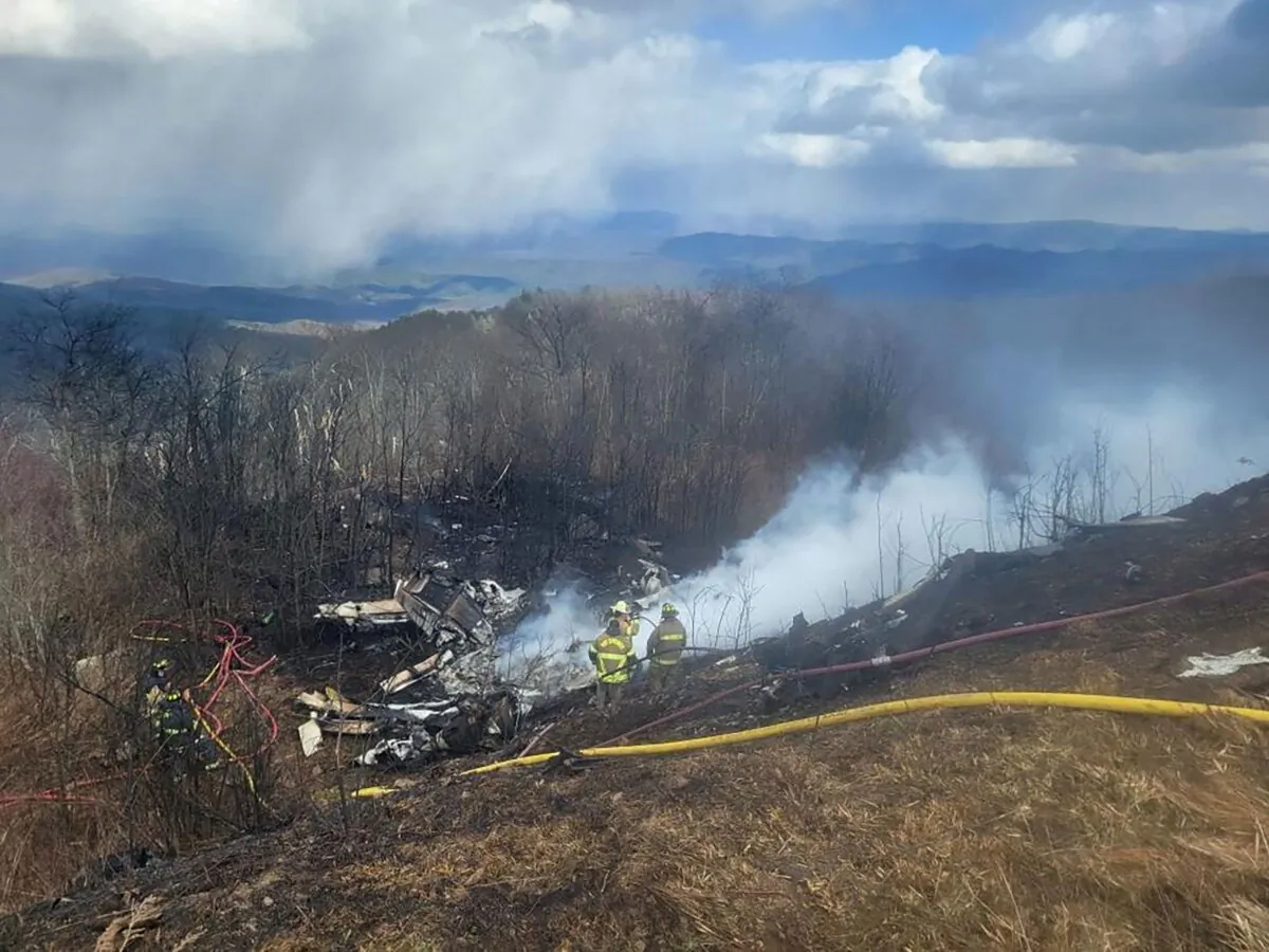 An emergency crew works at the site of a plane crash in Hot Springs, Va., on March 10, 2024. (Austin Hall/The Recorder via Reuters)
