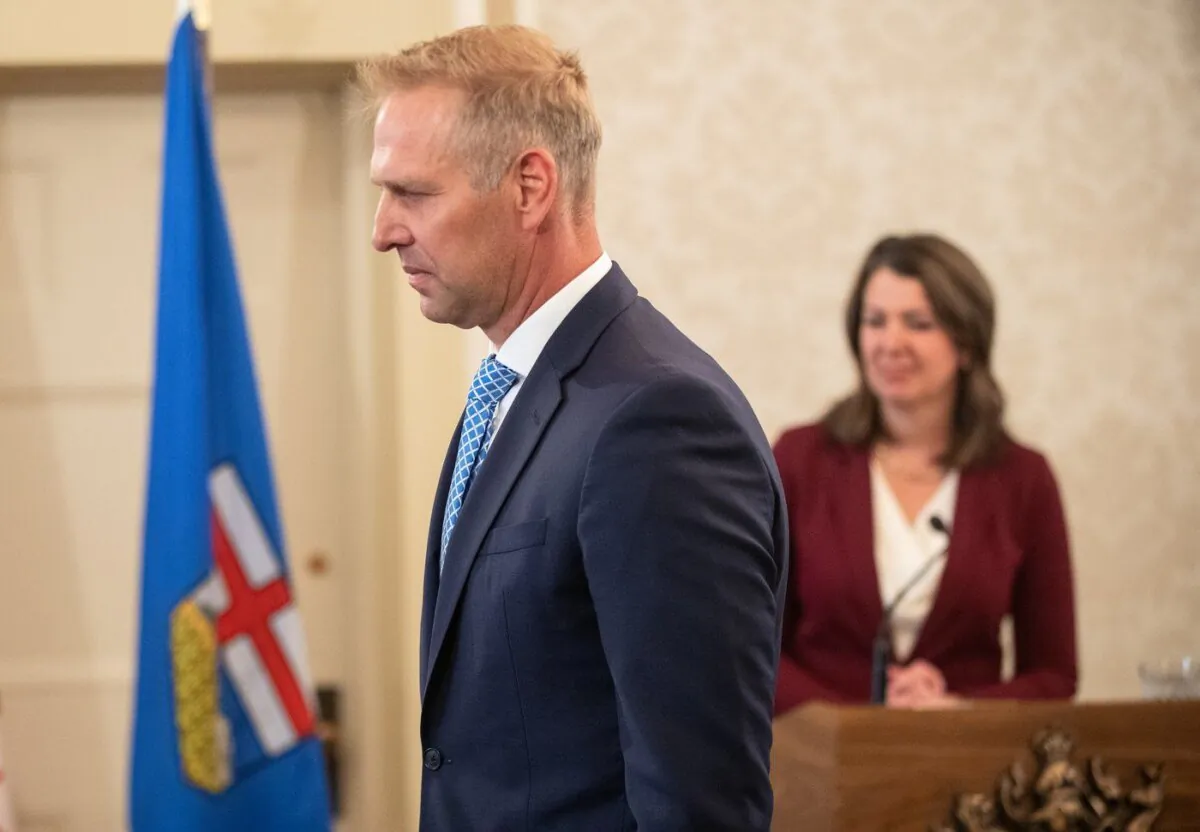 Alberta's government says it is updating its electricity market rules in order to help lower consumers' utility bills. Utilities Minister Nathan Neudorf is sworn into cabinet in Edmonton, June 9, 2023. (The Canadian Press/Jason Franson)
