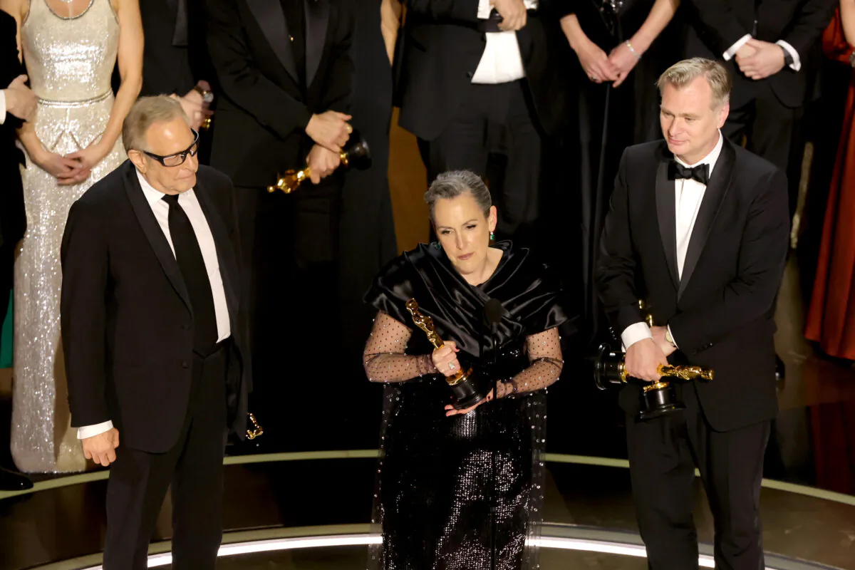 (L–R) Charles Roven, Emma Thomas, and Christopher Nolan accept the Best Picture award for "Oppenheimer" onstage during the 96th Annual Academy Awards at Dolby Theatre in Hollywood, Calif., on March 10, 2024. (Kevin Winter/Getty Images)