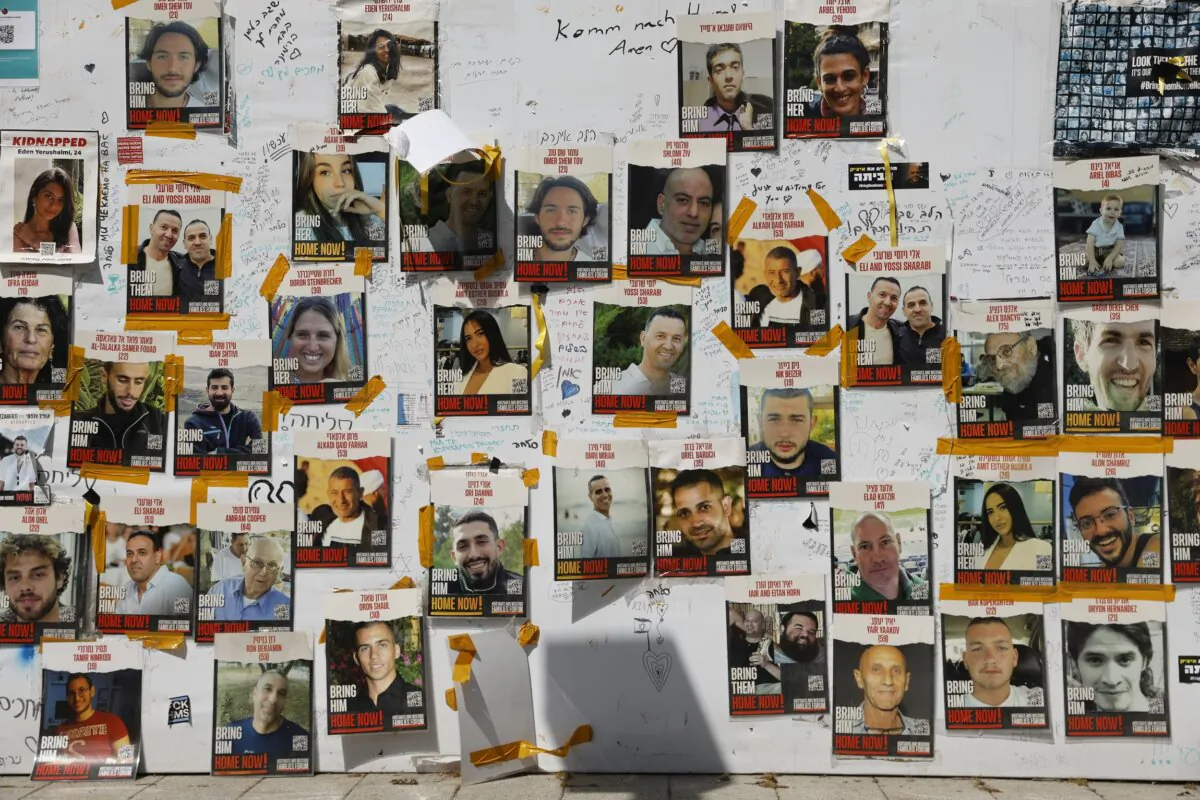 Pictures of hostages held in the Gaza Strip hang on a wall in southern Israel on March 7, 2024. (Amir Levy/Getty Images)