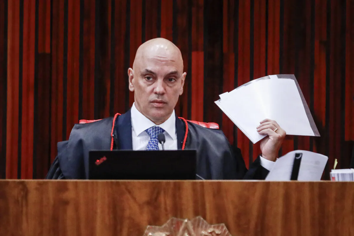 Brazil's Superior Electoral Court President Alexandre de Moraes holds documents during the fourth day of the trial of Brazilian former President Jair Bolsonaro, accused of abuse of power and misinformation, in Brasília, Brazil, on June 30, 2023. (Sergio Lima/AFP via Getty Images)
