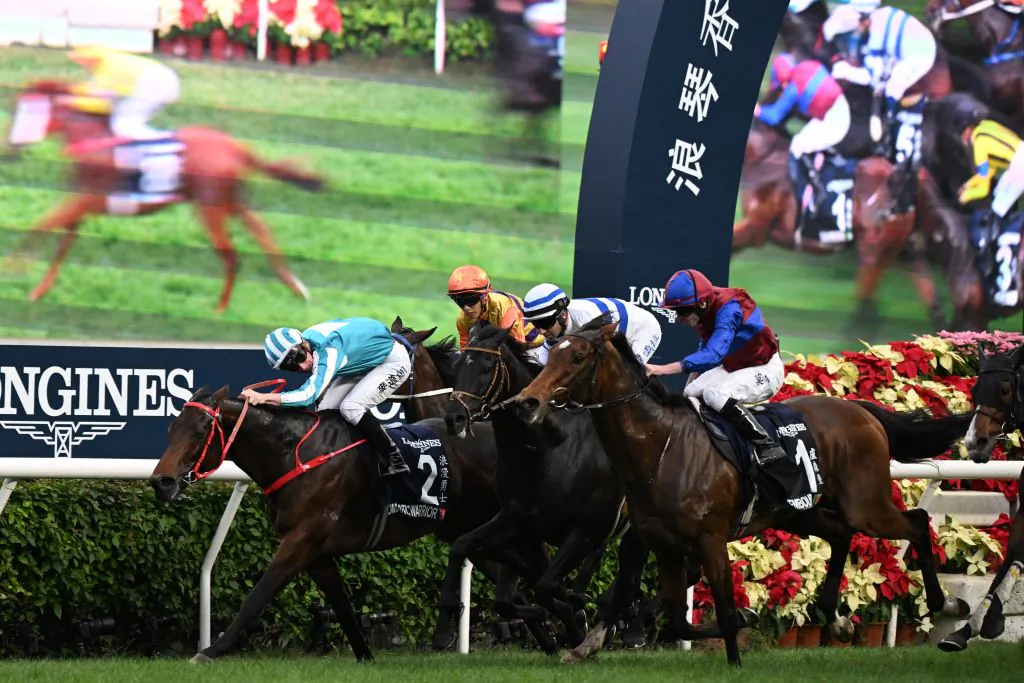 Romantic Warrior ridden by James McDonald (L) wins the Group 1 Hong Kong Cup race during the Hong Kong International Races at Sha Tin Racecourse in Hong Kong on Dec. 10, 2023. (Peter Parks/AFP via Getty Images)
