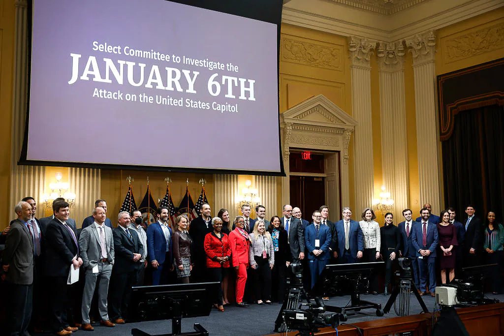 Members of the House January 6 committee pose for a group photo following the committee's last public hearing in the Canon House Office Building on Capitol Hill in Washington on Dec. 19, 2022. The committee approved its final report and voted to refer charges to the Justice Department of insurrection, obstruction of an official proceeding of Congress and conspiracy to defraud the United States against former President Donald Trump. (Chip Somodevilla/Getty Images)