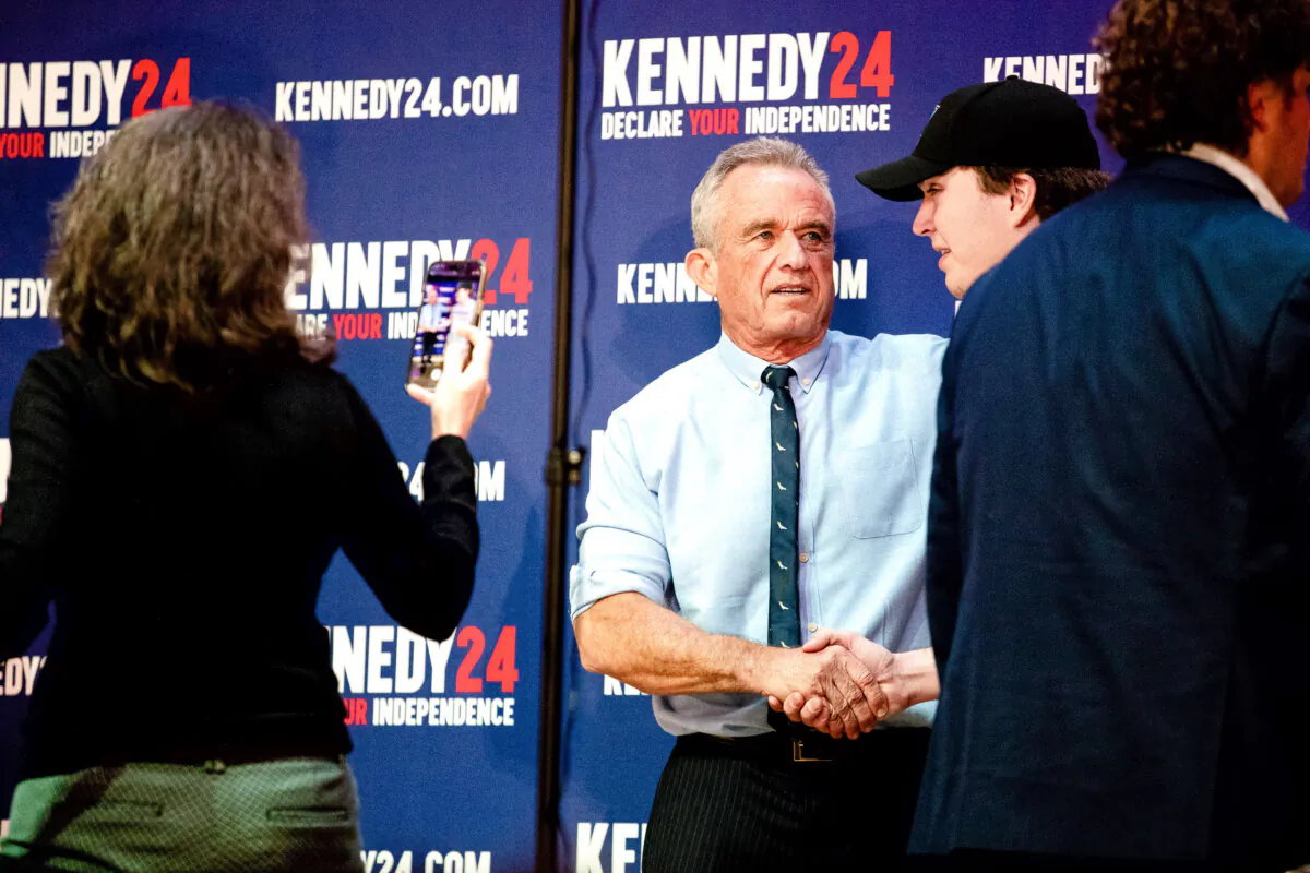 Independent presidential candidate Robert F. Kennedy Jr. poses with supporters during a meet and greet after a voter rally at St. Cecilia Music Center in Grand Rapids, Mich., on Feb. 10, 2024. (Emily Elconin/Getty Images)