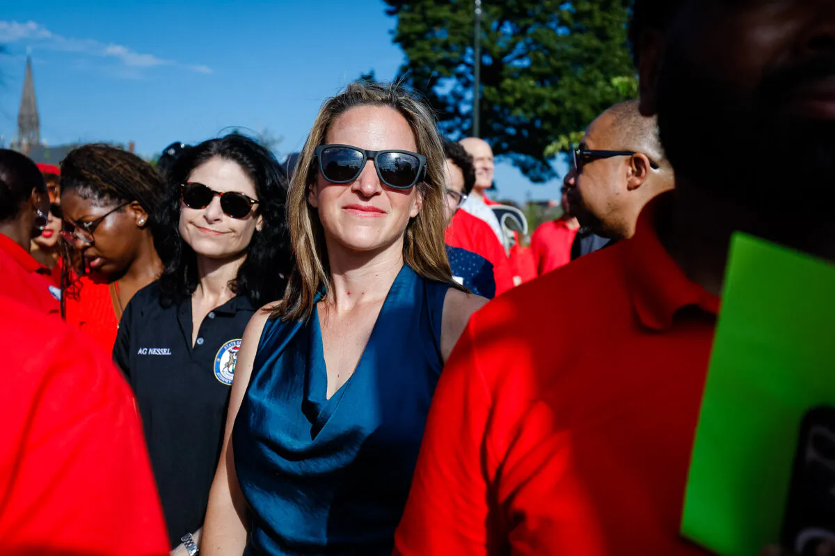 Michigan Secretary of State Jocelyn Benson (R) and Michigan Attorney General Dana Nessel (L) wait to speak at a United Auto Workers rally after the Detroit Labor Day Parade in Detroit on Sept. 4, 2023. (Bill Pugliano/Getty Images)