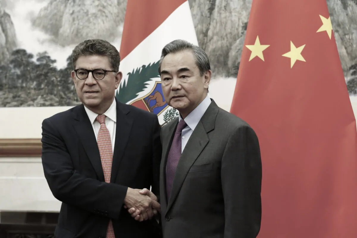 Peru's Foreign Minister Gustavo-Meza Cuadra and Chinese Foreign Minister Wang Yi shake hands before a meeting at the Diaoyutai state guesthouse in Beijing on Nov. 29, 2019. (Florence Lo-Pool/Getty Images)