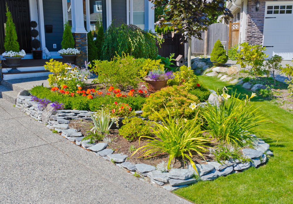 Planter beds are easy to work in and can be organized with shrubs and hedges at the back, perennials next, and annuals or ground cover in the front. (romakoma/Shutterstock)