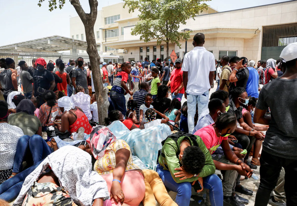 Haitians gather outside the U.S. Embassy after the assassination of President Jovenel Moise, in Port-au-Prince, Haiti July 9, 2021. (REUTERS/Estailove St-Val)