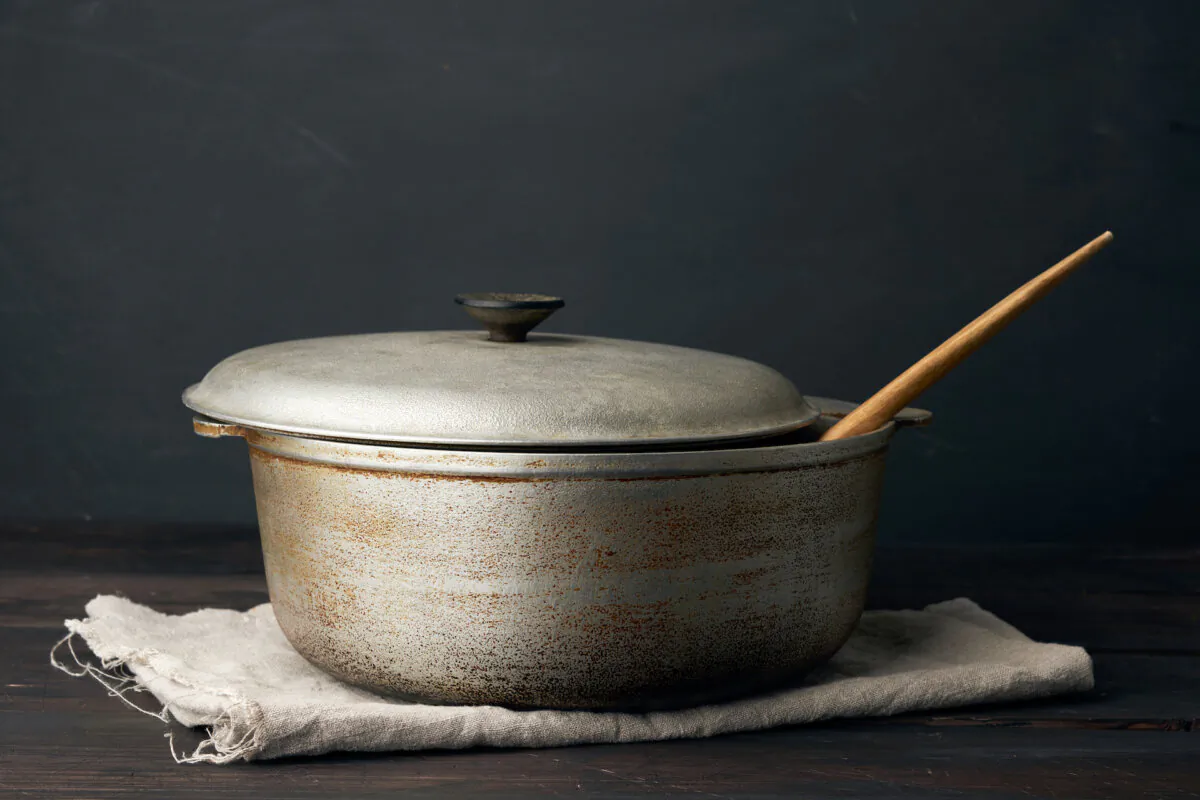 Removing dark stains from an aluminum cooking pot that has been damaged by the dishwasher can be challenging, but here are a few methods you can try to clean those stains to restore the beauty of polished aluminum—and then keep them that way. (NDanko/Shutterstock)