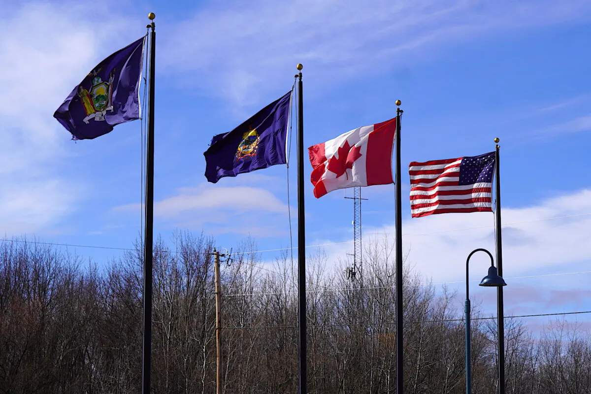 U.S. and Canada flags near the northern border in Vermont on March 7, 2024. (Allan Stein/The Epoch Times)