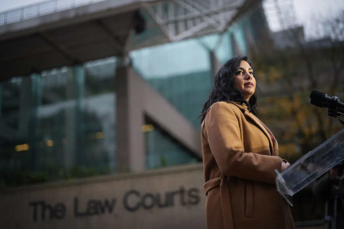 B.C. Attorney General Niki Sharma pauses while responding to questions outside B.C. Supreme Court in Vancouver on Nov. 27, 2023. (The Canadian Press/Darryl Dyck)
