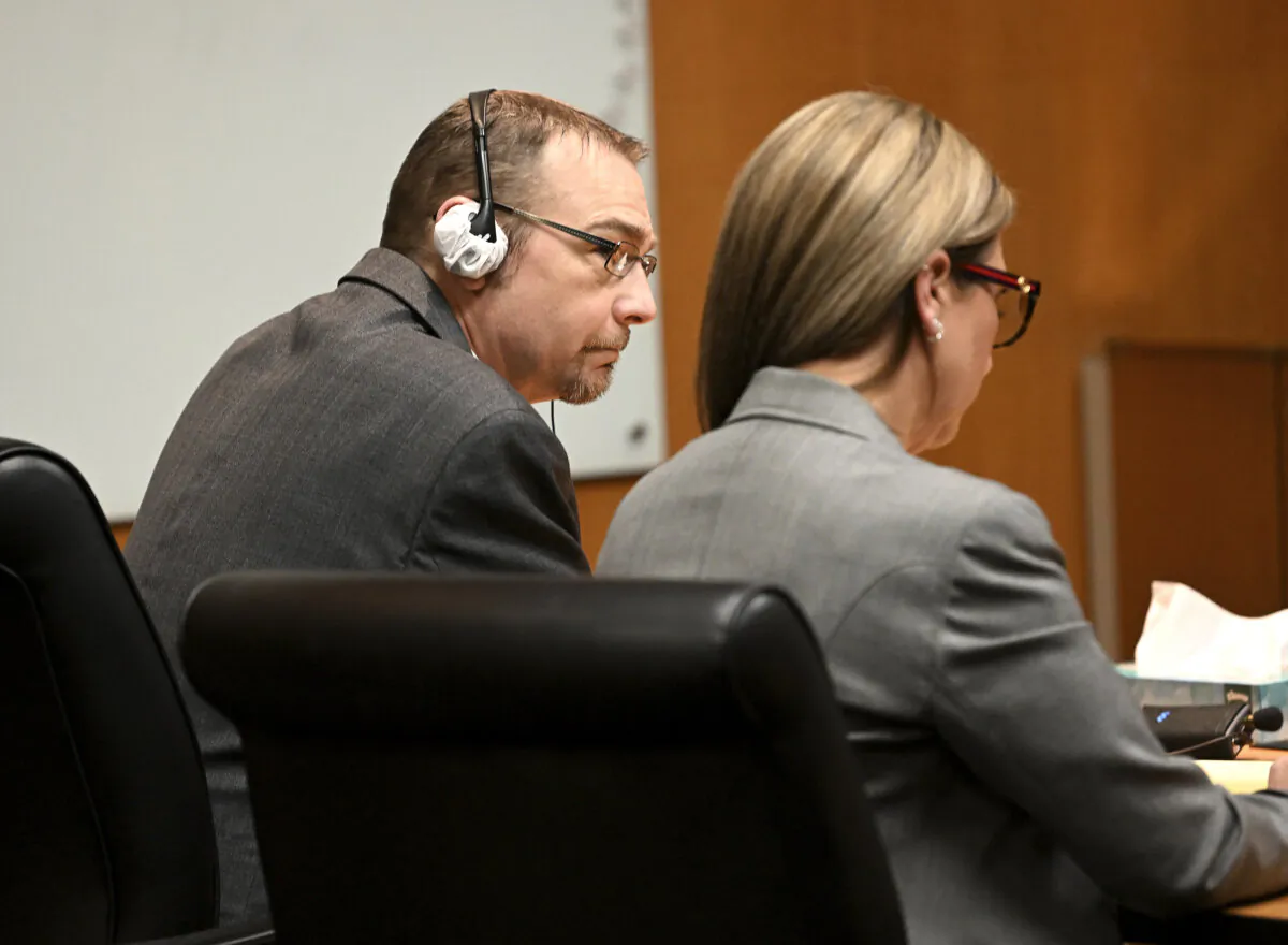James Crumbley (L) and his attorney Mariell Lehman listen to the verdict in Oakland County Court in Pontiac, Mich., on March 14, 2024. (Robin Buckson/Detroit News via AP, Pool)