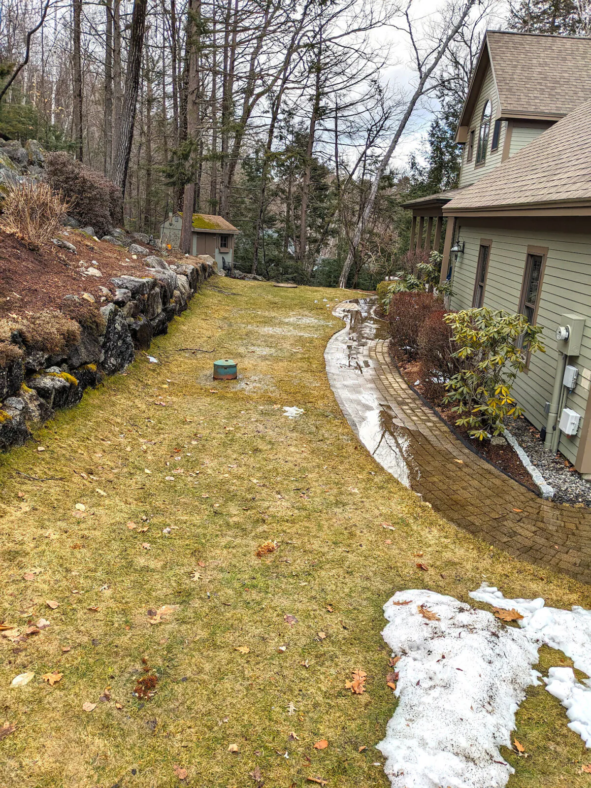 This ponding water in front of the house foundation can cause many problems. There's an easy way to prevent it. (Tim Carter/Tribune Content Agency)