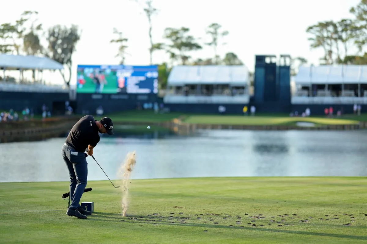 Wyndham Clark of the United States plays his shot from the 17th tee during the first round of THE PLAYERS Championship on the Stadium Course at TPC Sawgrass in Ponte Vedra Beach, Fla., on March 14, 2024. (Kevin C. Cox/Getty Images)